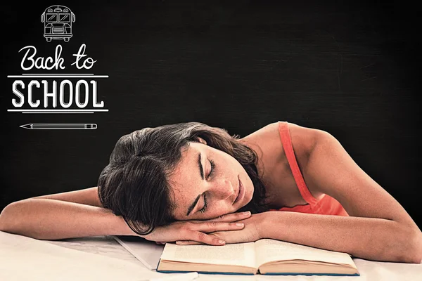 Sleeping student head on her book — Stock Photo, Image