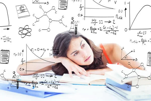 Bored female student doing homework — Stock Photo, Image