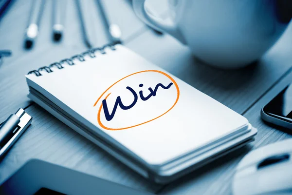 Win against notepad on desk — Stock Photo, Image