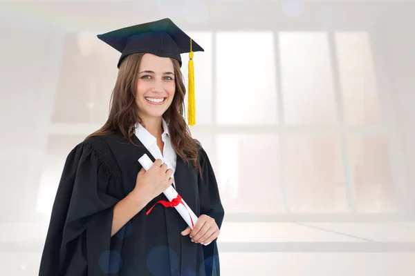 Smiling woman with her degree as she looks — Stock Photo, Image