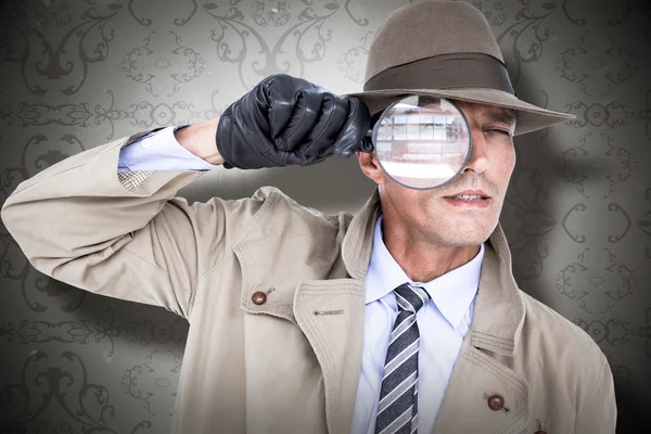 Spion op zoek via Vergrootglas — Stockfoto
