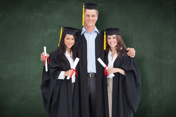 Full length of three friends graduate — Stock Photo, Image