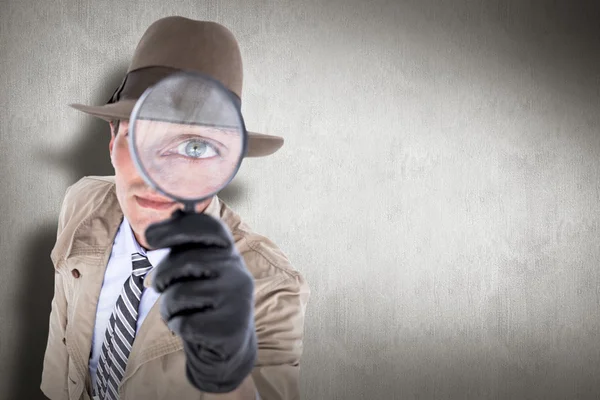 Spy looking through magnifier — Stock Photo, Image