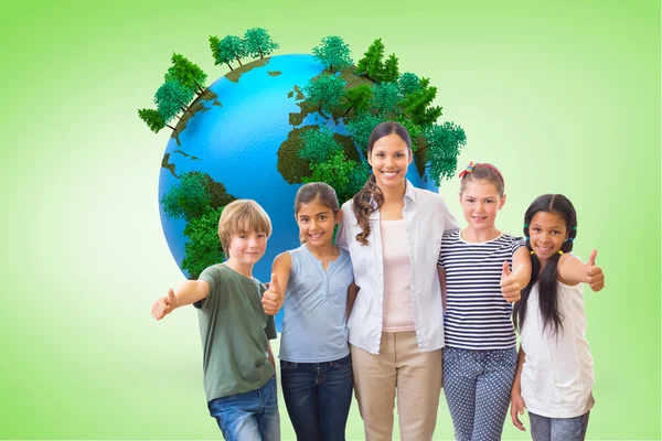 Cute pupils and teacher smiling — Stock Photo, Image