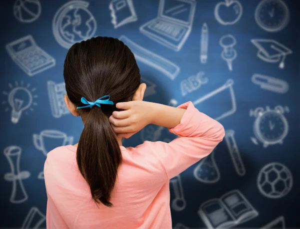 Pupil against blue chalkboard — Stock Photo, Image