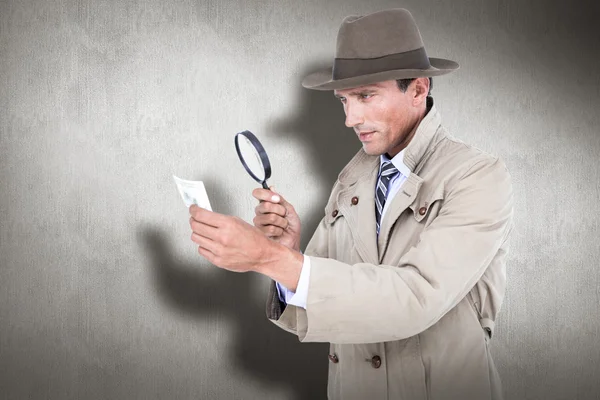 Spy looking through magnifier — Stock Photo, Image