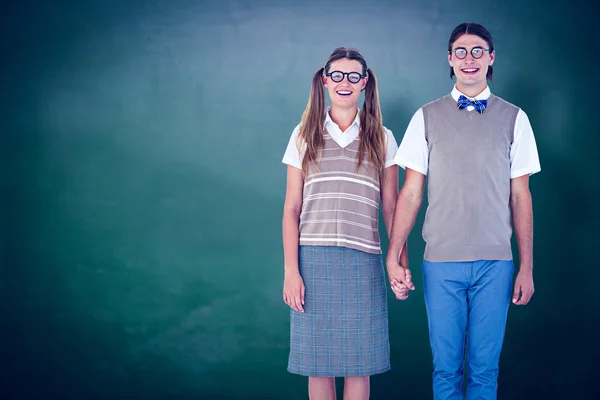 Geeky hipster couple holding hands — Stock Photo, Image