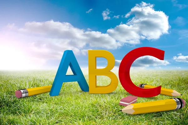 Abc graphic against sunny landscape — Stock Photo, Image