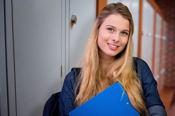 Student in the library against closed lockers — Stock Photo, Image