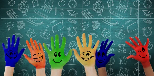 Hands with colourful smiley faces — Stock Photo, Image