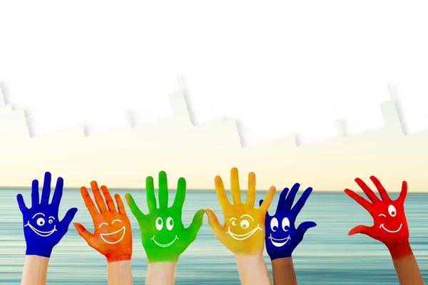 Hands with colourful smiley faces — Stock Photo, Image
