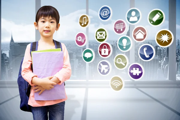 Pupil looking at camera holding notepad — Stock Photo, Image