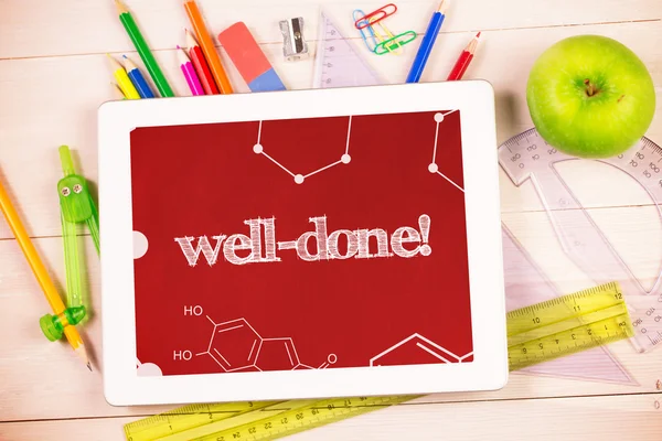 Well-done against students desk — Stock Photo, Image