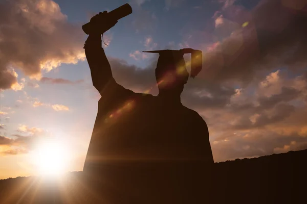 Imagem composta de silhueta de graduado — Fotografia de Stock