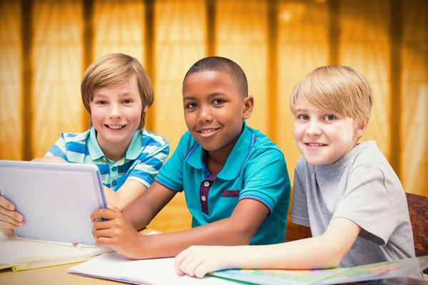 Cute pupils using tablet computer — Stock Photo, Image