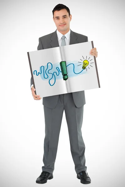 Businessman showing a book — Stock Photo, Image
