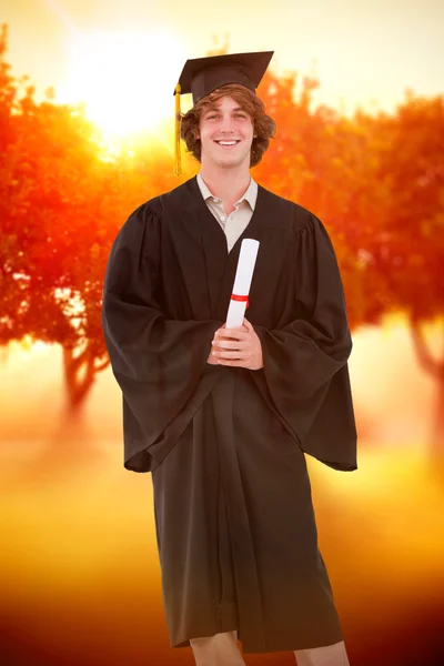 Smiling student in graduate robe — Stock Photo, Image