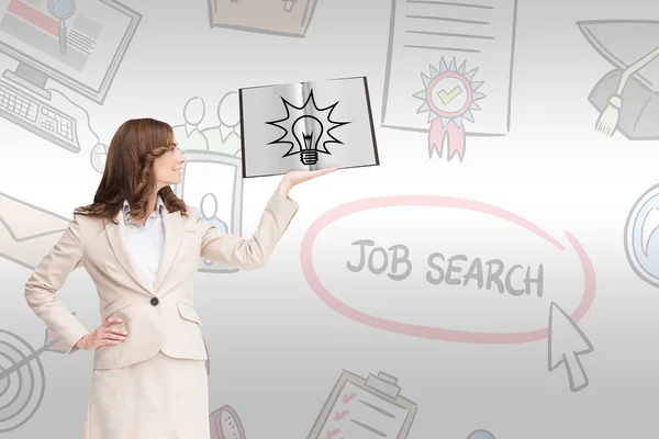 Pretty businesswoman showing a book — Stock Photo, Image