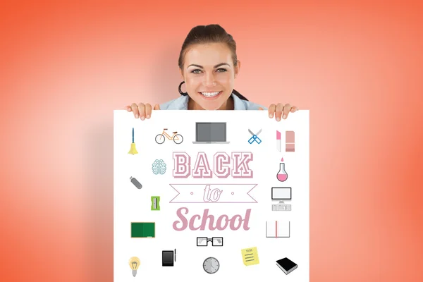 Businesswoman holding back to school  sheet — Stock Photo, Image