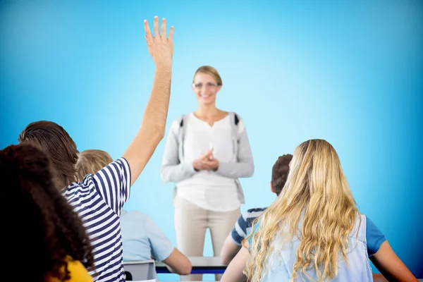 Student raising hand in classroom — Stock Photo, Image