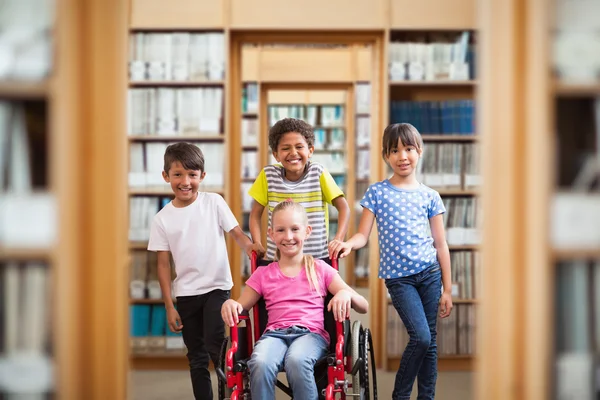 Kompositbild eines süßen behinderten Schülers, der mit ihm in die Kamera lächelt — Stockfoto