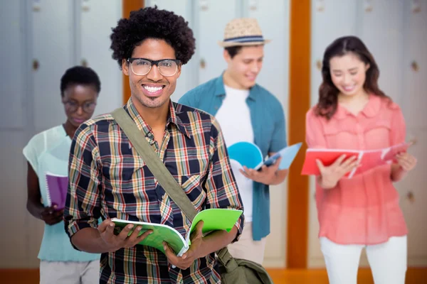 Stylish students smiling at camera together — Stock Photo, Image