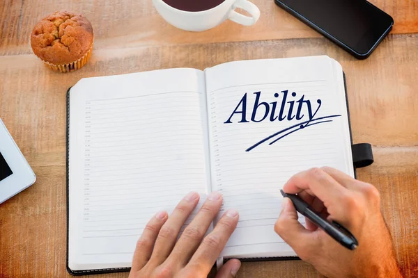 Man writing notes on diary — Stock Photo, Image