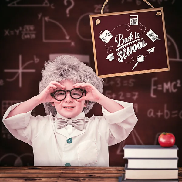 Cute pupil in lab coat — Stock Photo, Image