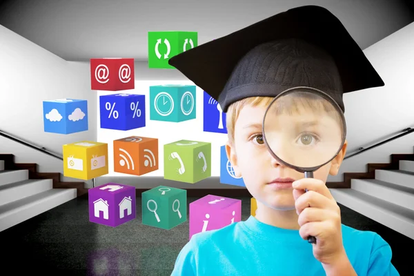 Pupil looking through magnifying glass — Stock Photo, Image