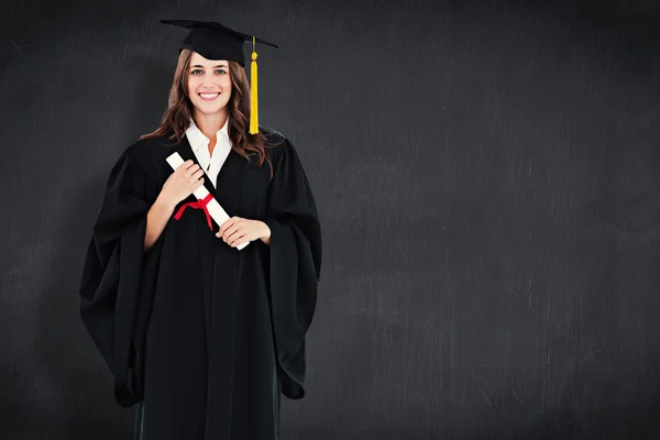 Full length shot of a graduate holding a degree — Stock Photo, Image