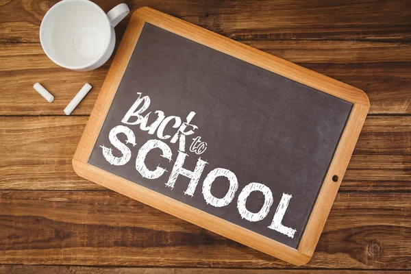 Back to school words against chalkboard — Stock Photo, Image