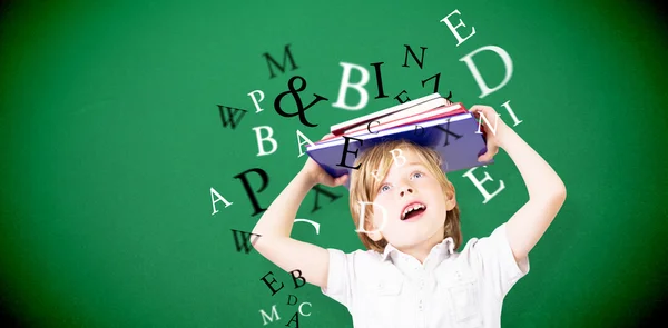 Cute pupil holding books — Stock Photo, Image