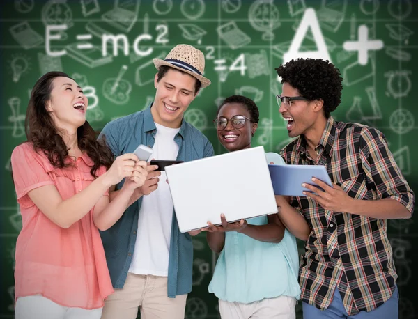 Friends using their technology — Stock Photo, Image