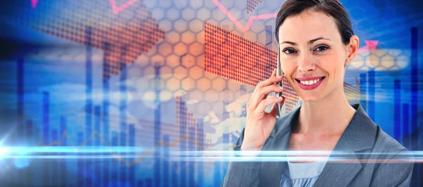 Businesswoman on the phone against stocks — Stock Photo, Image