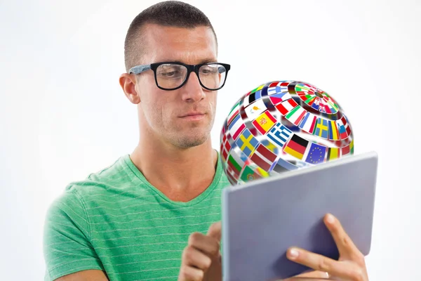 Man wearing glasses while using tablet computer — Stock Photo, Image