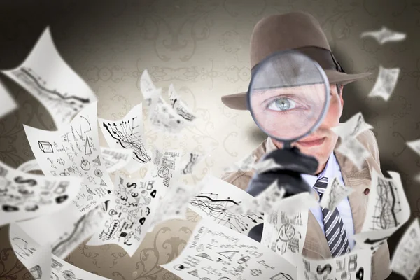 Spy looking through magnifier — Stock Photo, Image