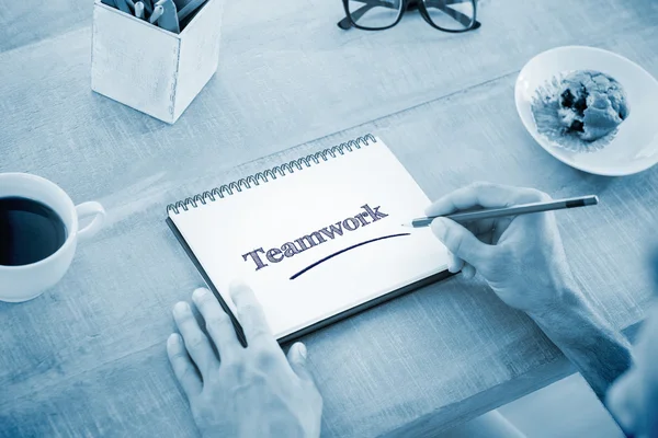 Man writing notes on notebook — Stock Photo, Image