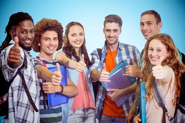 Groep studenten doen duimen omhoog Stockfoto