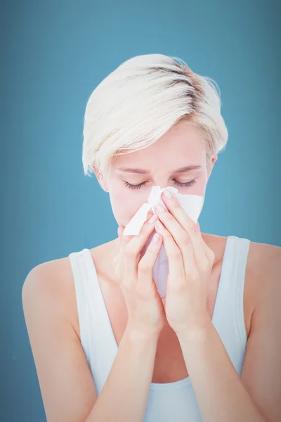 Sick woman blowing her nose — Stock Photo, Image