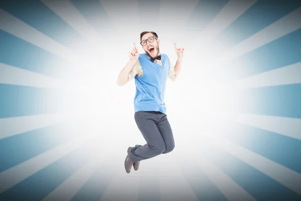 Geeky hipster jumping and smiling — Stock Photo, Image