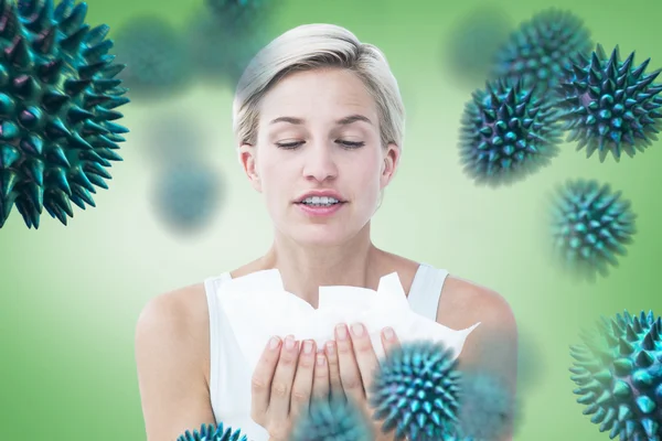 Composite image of sick woman holding tissues — Stock Photo, Image