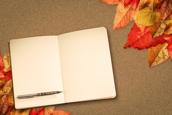 Composite image of notebook and pen — Stock Photo, Image