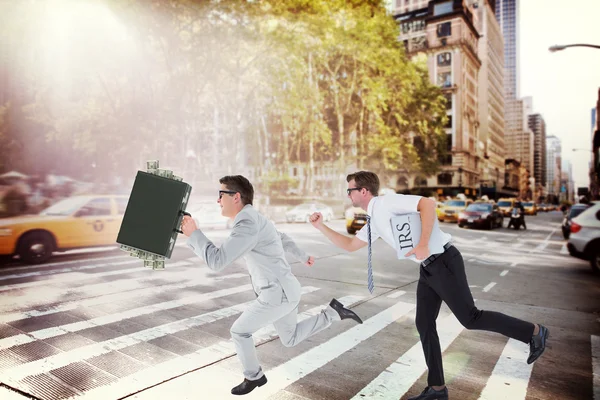Running businessmen against street — Stock Photo, Image