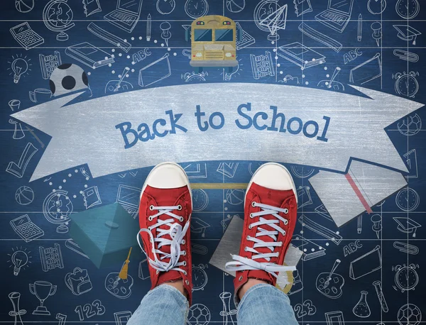 Back to school against blue chalkboard — Stock Photo, Image