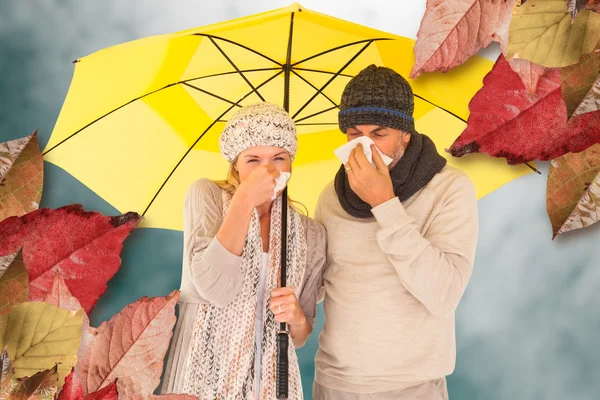 Couple sneezing in tissue while standing — Stock Photo, Image