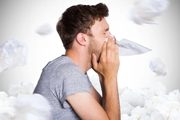 Close up side view of man blowing nose — Stok Foto