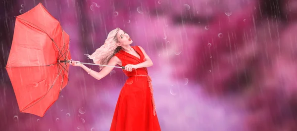 Elegant blonde holding umbrella — Stock Photo, Image