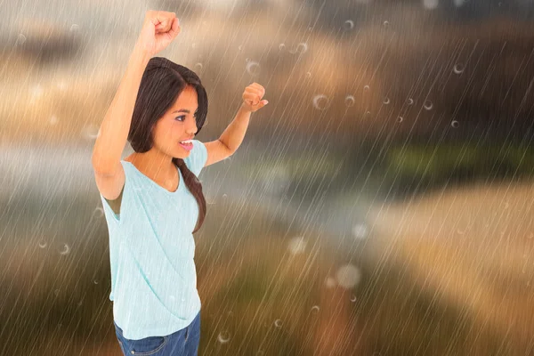 Composite image of brunette cheering — Stock Photo, Image