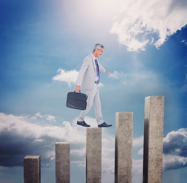 Side view of businessman walking with briefcase — Stock Photo, Image