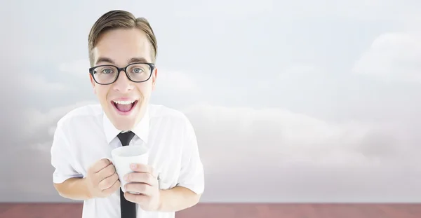 Composite image of geeky businessman holding a mug — Stock Photo, Image